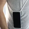A person wearing a gray t-shirt with a phone hanging from a white lanyard around their neck. Náhled obrázku produktu