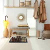 An entryway with a bench, shoe rack, mirror, coats, and an umbrella stand. Náhled obrázku produktu
