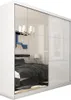 A white wardrobe with mirrored doors reflecting a bedroom interior. Produktbild-Vorschau