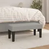 A bench in front of a bed in a bedroom. Produktbild-Vorschau