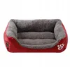 A red and gray dog bed is shown against a white background. Anteprima dell’immagine prodotto