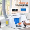 A person is using an airbrush to paint a small figurine inside a portable airbrush spray booth with a filtration system. Náhľad obrázku produktu
