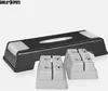 A black and gray aerobic stepper with two sets of risers, presented on a white background. Náhled obrázku produktu