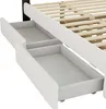 A close-up view of the drawers of a white upholstered bed frame, showing the wooden slats of the bed base. Produktbild-Vorschau