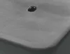 A close-up view of a gray textured surface with a dark, reflective liquid droplet on it. Produktbild-Vorschau