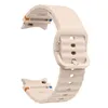 A beige silicone watch band with a wavy texture and orange and blue accents on the connectors. Náhled obrázku produktu