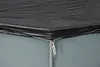 Close-up view of the corner of a black oval pool cover, showing how it is secured to a pole with white rope. Produktbild-Vorschau