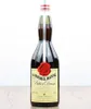 A bottle of Gammel Dansk Bitter Dram is displayed on a wooden surface against a white background. Produktbild-Vorschau