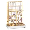 A jewelry stand filled with various necklaces, earrings, bracelets, and watches, displayed on a white surface. Náhled obrázku produktu