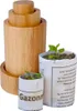 A wooden tool and two small plant pots with seedlings are displayed against a white background. Produktbild-Vorschau