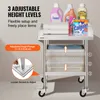 A stainless steel rolling cart with laundry supplies and towels on it, highlighting adjustable height levels. Produktbild-Vorschau