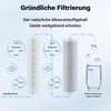 Diagram illustrating the filtration process of water, showing two filter cartridges and the removal of various impurities while retaining minerals. Produktbild-Vorschau