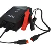A black battery charger with red and black clamps is shown against a white background. Produktbild-Vorschau