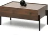 A modern coffee table with a wooden finish and black legs, featuring two decorative spheres on top. Náhled obrázku produktu