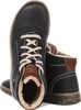 A pair of black leather boots with fur lining. Voir les images du produit
