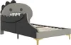 A child's bed with a dinosaur-shaped headboard, shown from a side angle against a white background. Produktbild-Vorschau
