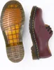 A pair of Dr. Martens shoes, one showing the sole and the other the side view, on a white background. Produktbild-Vorschau