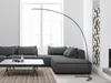 A modern living room with a sectional sofa, coffee table, and a floor lamp. Produktbild-Vorschau