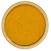 A top-down view of ground turmeric in a wooden bowl. Anteprima dell’immagine prodotto