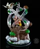 A figurine of Aang from Avatar: The Last Airbender, with Momo flying above him, set against a black background. Náhled obrázku produktu