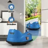 Two blue bumper cars are shown, one in the foreground and one in the background, with a doorway opening to a garden path. Anteprima dell’immagine prodotto