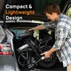 A man is loading a folded electric bicycle into the trunk of a car. Produktbild-Vorschau