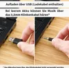Close-up shots of hands connecting a USB cable and a 3.5mm audio jack to a black electronic device, with text overlays explaining charging and audio connection options. Produktbild-Vorschau