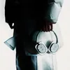 A person is holding a pair of white headphones. Náhľad obrázku produktu
