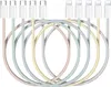 A collection of braided charging cables in pastel colors, with white connectors at the top. Produktbild-Vorschau