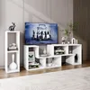 A modern living room setup featuring a white TV stand with a television and decorative items. Náhled obrázku produktu