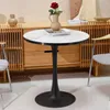A round marble-top table with a black pedestal base, set in a room with wooden cabinets and chairs. Anteprima dell’immagine prodotto