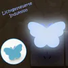 A butterfly-shaped LED night light plugged into a wall socket, with a smaller inset image showing the product's design. Produktbild-Vorschau