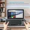 A person is holding a wireless keyboard with a trackpad in front of a large TV screen displaying a Windows interface. Produktbild-Vorschau