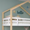 Close-up of a child's bed with decorative elements on the wall. Produktbild-Vorschau
