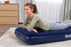 A woman is lying on an inflatable mattress in a room. Náhľad obrázku produktu