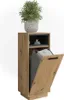 A tall, narrow laundry cabinet with a wooden finish and an open door revealing a gray fabric laundry bag inside. A small black shelf above holds a brush. A potted plant sits on top. Produktbild-Vorschau