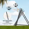 A soccer rebounder net is shown in action with soccer balls in motion, set against a sky background with clouds and green grass. Voir les images du produit