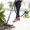 A person is using a wet and dry vacuum cleaner outdoors near a swimming pool. Anteprima dell’immagine prodotto