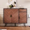 A wooden sideboard with black metal legs is displayed in a room with a painting on the wall. Náhled obrázku produktu