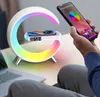 A person is using a smartphone to control the lighting of a multi-functional desk lamp with a built-in wireless charger and alarm clock. Produktbild-Vorschau