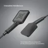 A close-up studio shot of a black shower head and a separate black component, likely part of a shower system, against a gradient gray background. Produktbild-Vorschau