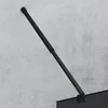 A black shower rod attached to a concrete wall. Produktbild-Vorschau