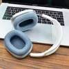 A pair of headphones rests on a laptop keyboard. Produktbild-Vorschau