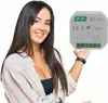 A woman is holding a small electronic device in front of a white background. Náhľad obrázku produktu