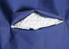 A close-up view of a blue fabric with a zipper partially open, revealing white filling material. Produktbild-Vorschau