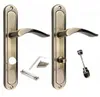 Two door handles with accessories on a white background. Produktbild-Vorschau