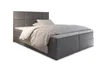 A studio shot of a gray box spring bed with white bedding. Produktbild-Vorschau