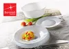 A collection of white Bormioli Rocco Ebro soup plates and a bowl, with tulips and pasta, arranged on a table with a decorative runner. Anteprima dell’immagine prodotto