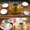 A collage of images showing a glass teapot with tea leaves and a tea strainer, a white teacup with a tea strainer, and a teacup being filled with tea from a teapot. Produktbild-Vorschau