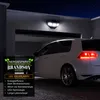 A white car is parked in a garage at night, illuminated by a solar-powered LED lamp mounted above the garage door. A promotional graphic is overlaid on the left side of the image. Produktbild-Vorschau